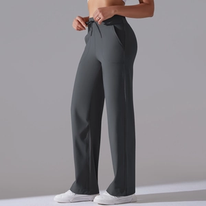 Detailed side view of high-waisted dark gray yoga pants with drawstring and side pockets