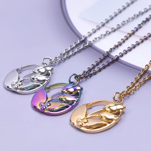 Detailed macro view showing three tulip-shaped pendants in silver, gold and aurora colors