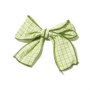 Cute green plaid fabric bow hair clip with dark green stitched edges for girls