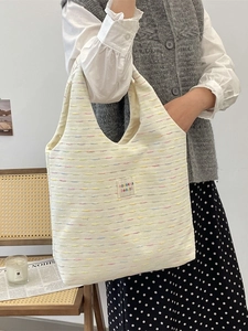 Sweet chic off-white canvas tote bag with colorful embroidery and a shoulder strap