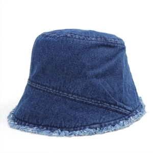 Deep blue denim bucket hat with frayed edges and trendy sun protection design