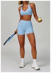 Close-up of light blue high-waisted yoga shorts with seamless texture and athletic fit