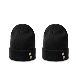 Set of two black knit beanies with decorative green buttons and classic folded cuffs