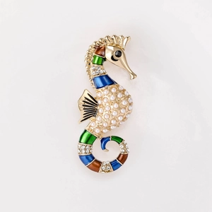 Artistic gold seahorse brooch with white pearls and colorful enamel details