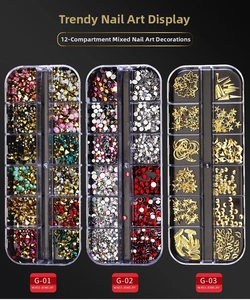 Detailed macro view of 12-grid nail art kit with assorted mixed rhinestones and gold charms