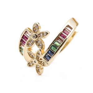 Detailed macro view of dual gold flower rings set with rainbow zircon stones