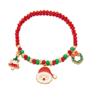 Christmas beaded bracelet with Santa, tree and wreath charms in festive red and green