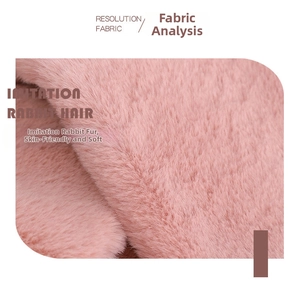Detailed macro view of soft pink faux rabbit fur fabric with plush texture and shine