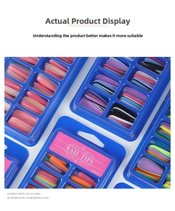 Macro shot of 100-piece ballet nail tips set in assorted vibrant colors with blue packaging