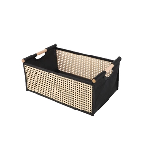 Handwoven foldable rattan storage basket with wood handles and black canvas panels