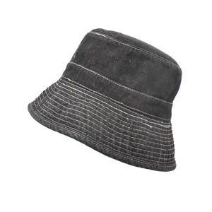 Detail view of washed denim bucket hat with white contrast stitching and durable fabric