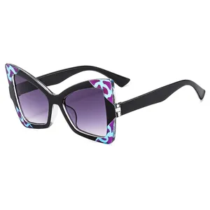 Butterfly frame sunglasses with purple gradient lenses and marble pattern details