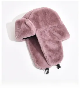 Detail view of plush faux fur trapper hat featuring warm earflaps and secure chin buckle