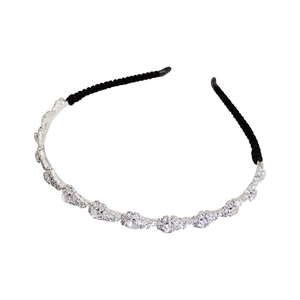 Elegant silver metal headband featuring sparkling rhinestones and pearls on white base