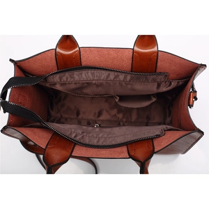 Interior view of brown PU leather tote bag with fabric lining and zipper pocket