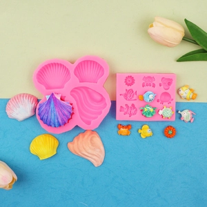 Pink ocean theme silicone molds for fondant featuring shells, fish and crab shapes