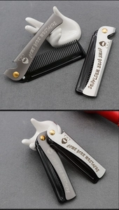 Detail of professional folding hair combs with steel handles and mustache engraving