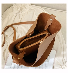 Top view of caramel brown bucket bag showing interior storage capacity and inner pouch