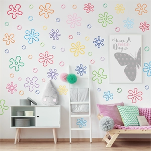 Scene showing colorful flower and bubble wall stickers in a modern child's room setup.