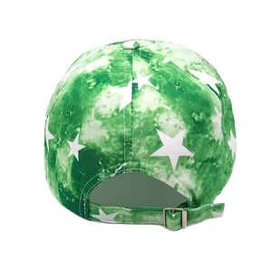 Detail view of the metal buckle and star pattern on green tie-dye baseball cap