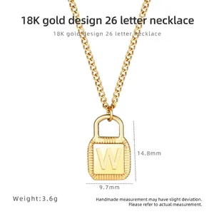 Detail view of 18K gold letter W padlock pendant with dimensions 14.8mm x 9.7mm and 3.6g weight