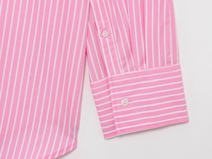 Detailed macro view of pink striped cotton shirt cuffs and stitching quality