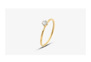 Macro shot of 18k gold plated ring featuring a single sparkling round cut zirconia stone