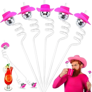 Detail of transparent spiral straws with pink cowboy hats and disco mirror ball decorations