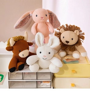 Detailed knit texture of handmade crochet animal dolls like rabbits and a lion toy