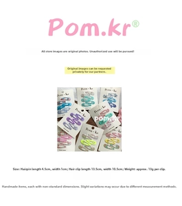 Detailed view of colorful fabric BB clips with floral and plaid patterns on card display