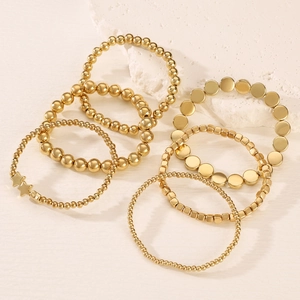 Set di bracciali con perline dorate fatte a mano con stelle e forme geometriche su pietra