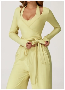 Detail of the tie-front wrap long sleeve sports top and high waist loose yoga pants