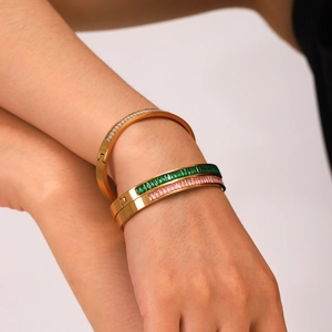 Detail of three-piece 18K gold-plated stainless steel bangles with colorful zircon stones