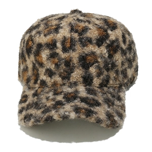 Detail of leopard print baseball cap featuring soft faux lamb wool and textured fleece material
