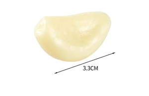Macro-opname van 3,3 cm levensechte PVC knoflookteentje met gedetailleerde textuur