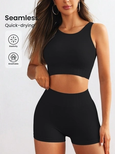 Detail showing seamless ribbed black sports set with racerback top and high waist shorts