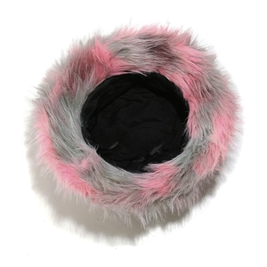 Detail view of pink and grey faux fur bucket hat with soft plush texture and black lining