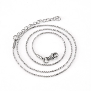 Detail of stainless steel link chain featuring lobster clasp and extension for DIY jewelry