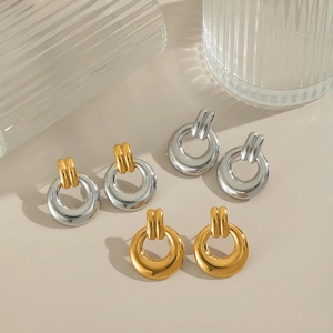 Polished geometric hoop earrings in gold, silver, and two-tone finishes for women