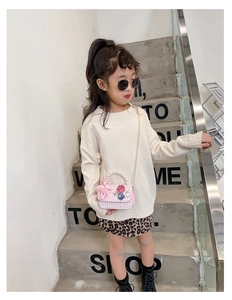 Pink pearl handle shoulder bag for girls with knit sweater and leopard skirt