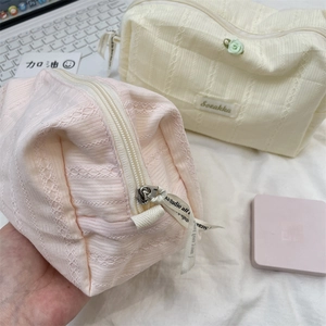 Quilted fabric cosmetic bags in pink and cream with rose accents and ribbon zippers