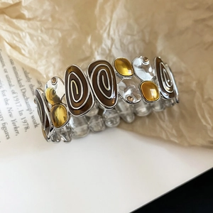 Retro wide elastic bracelet with silver metal base and brown enamel spiral pattern