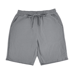 Detail of grey linen-blend summer shorts with elastic drawstring waist and side pockets