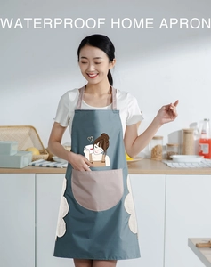 Detailed view of gray waterproof apron with pink pockets and cute cartoon girl pattern