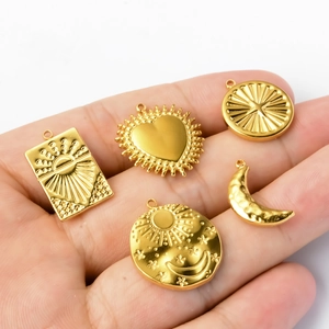 Golden stainless steel celestial charms set featuring sun moon and star embossed patterns