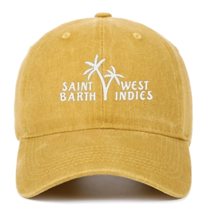 Close-up of Saint Barth West Indies palm tree embroidery on mustard yellow cotton baseball cap