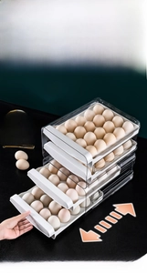 Macro view of four-layer stackable egg drawer storage box with smooth pulling handle