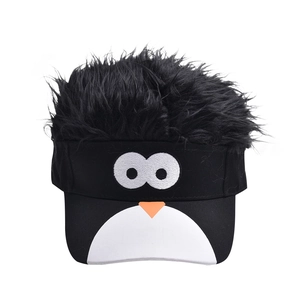 Detail of penguin embroidery on sun visor cap with black synthetic hair toupee top