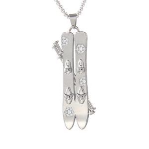 Creative stainless steel ski pendant necklace featuring snowflake pattern on white background