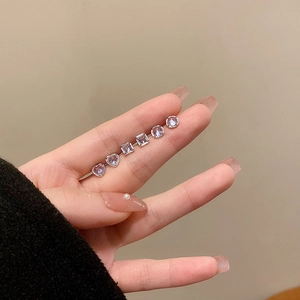 Three-pair silver stud earring set featuring heart, square, and round lavender zircons